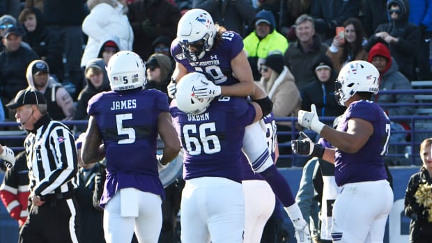 Northwestern Wildcats wide receiver Riley Lees (19) celebrates his touchdown against the Purdue Boilermakers offensive lineman Nik Urban (66) during the second half at Ryan Field. David Banks-USA TODAY Sports